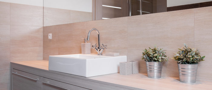 Close-up of porcelain washbasin in bright bathroom